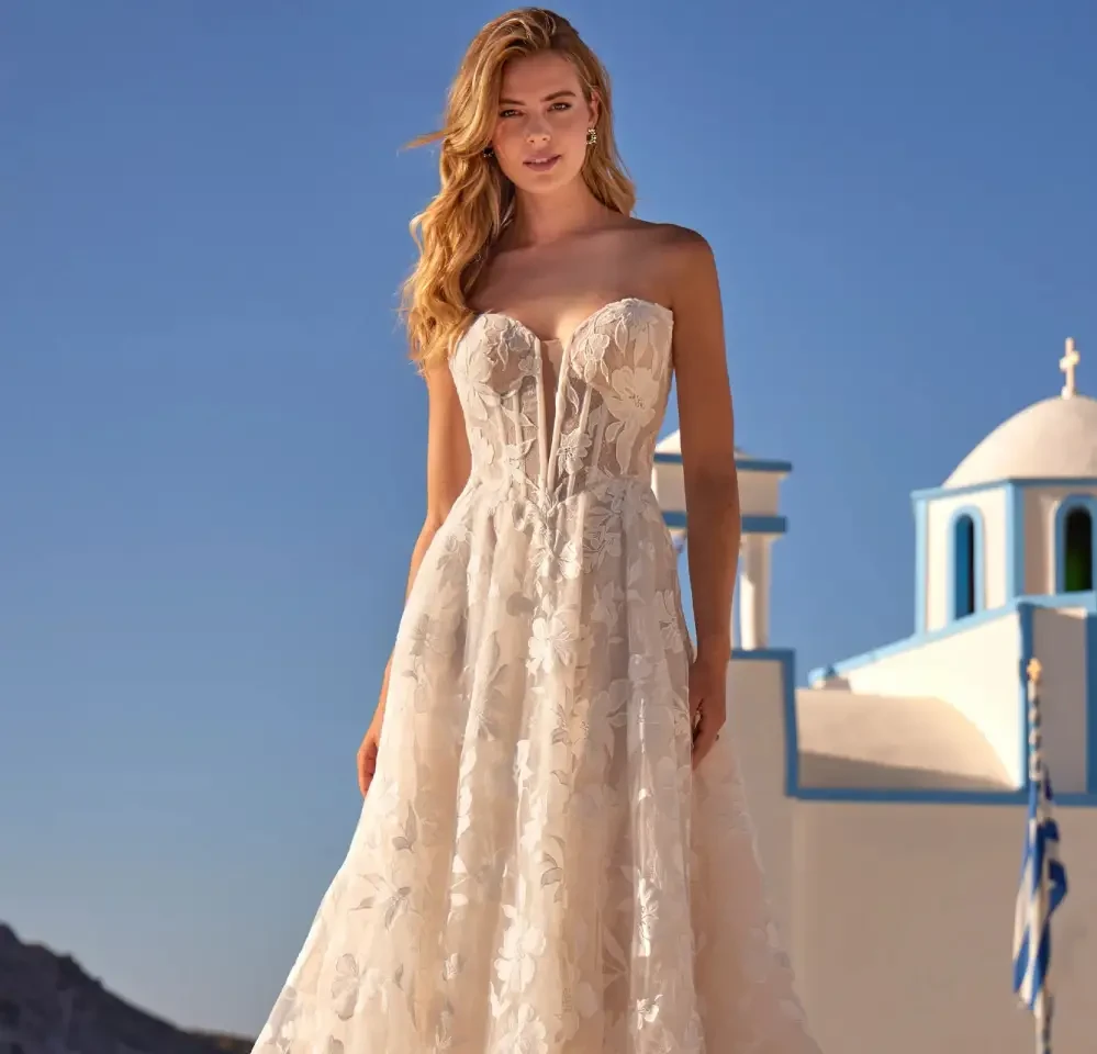 Model wearing a gown by Madison James