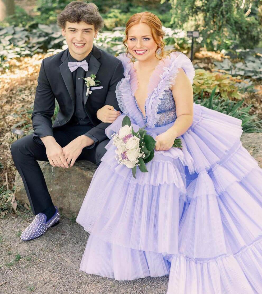 Сouple wearing a pink gown and a black suit